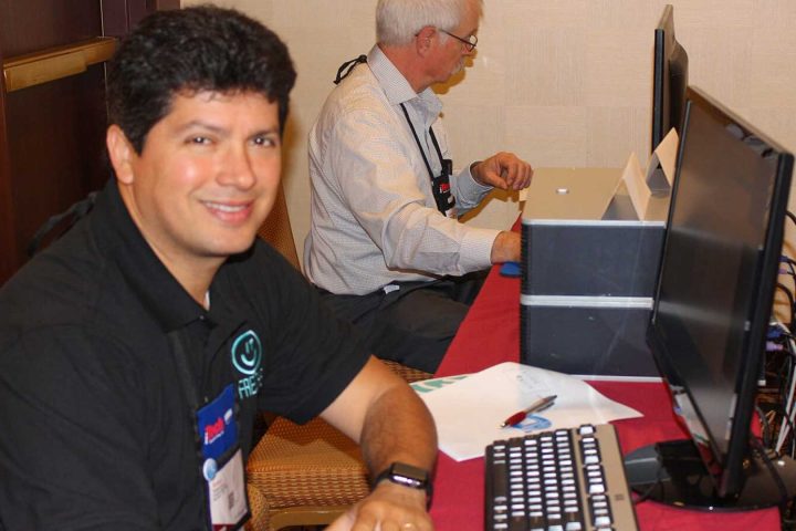 Robert Arce at a computer